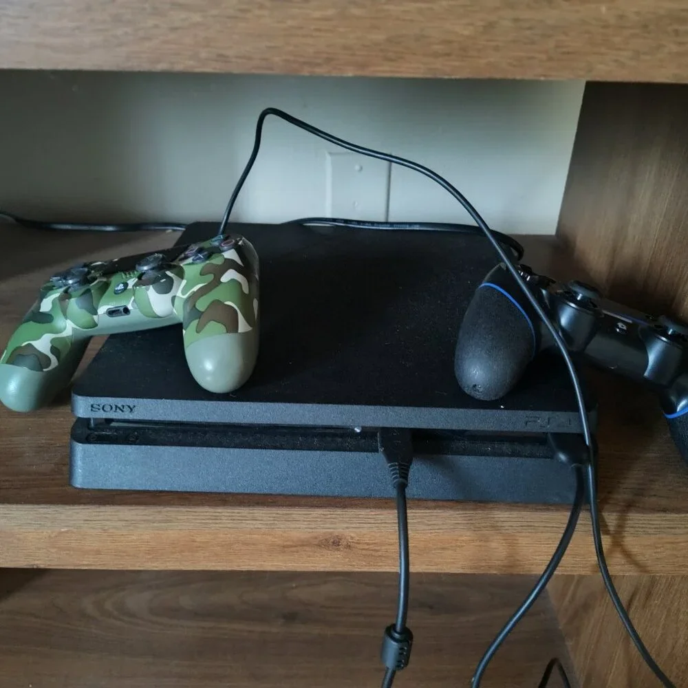 PS4 with 2 controllers and 6 games